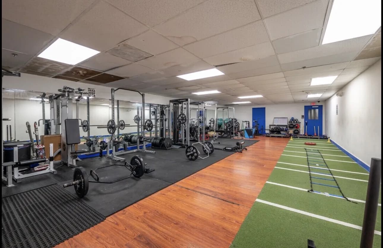 Free-weight rack and dumbbells at the BriceBuilt facility